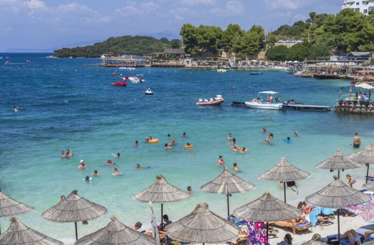 Local,People,And,Tourists,Enjoying,On,Ksamil,Beach,,Washed,By
